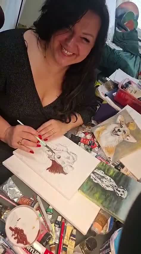 Artist Aldija Balode with a pet portrait